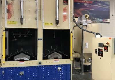Dual station cell type pressure blast system for ID and OD peening